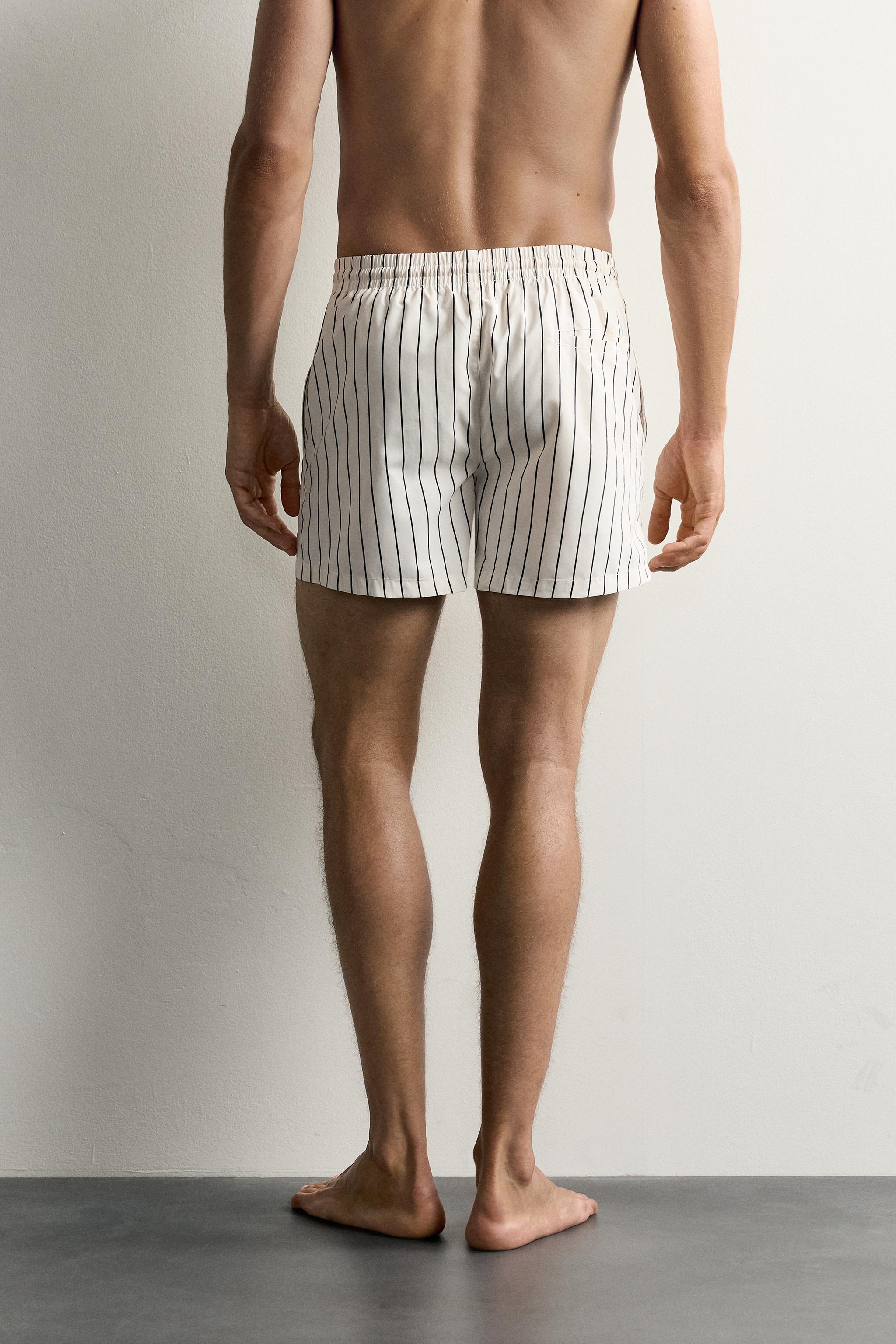 STRIPED MID-LENGTH SWIM TRUNKS